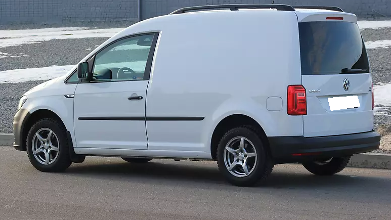 белый Кадди сбоку